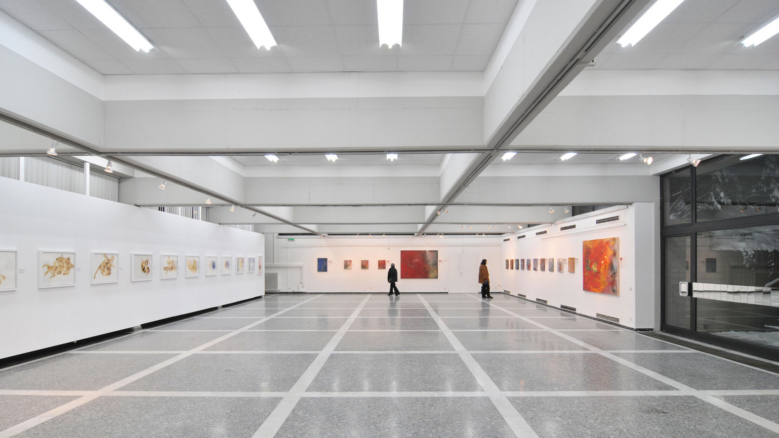 Thomas Girbl exhibition at Alpen-Adria-Galerie Klagenfurt featuring live fire performance after residency at Cité Internationale des Arts Paris.