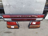 На Ниссан Цефиро Cefiro A32, 1994-1997 г.в. – фонарь стоп сигнал панорама катафот с надписью на крышку багажника на седан, оригинал, б/у. Цена за комплект.
