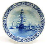 A wall plate by Delft Porceleyne Fles, after a painting by Willem van de Velde (de Jonge) 1633-1707