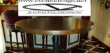 TAVOLO ALTO CON PIANO IN LEGNO MASSELLO DIAMETRO 60X3 TINTA NOCE A BASE IN GHISA NERO BUCCIATO 1013B