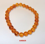 KR8AMBE KOGELARMBAND AMBER REK