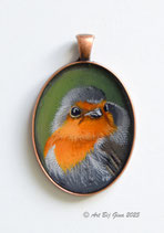 Mooi roodborstje geschilderd op een rood koperen hanger