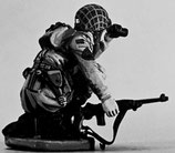 MOD S-168 crouching with binoculars