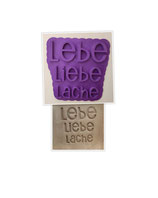 Schriftzug "Lebe,liebe,lache"