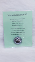 Schmunzelstein (Lachgesicht mit Wimpern)