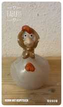 Huhn mit Kopftuch