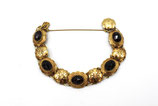 14 Karaat gouden armband bezet met facetgeslepen granaten, ca.1975.