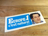 Autocollant "Europe 1 c'est naturel - Coluche" (1985)