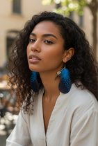 Boucle d'oreille plume coeur