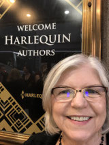 author Diane Gaston reading a book