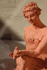 Woman with a Small Bird, sculpture by Sarah Myers