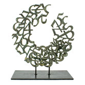 Paolo Grassi bronze sculpture titled Love, circular form with green patina and numeric structure