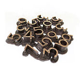 Paolo Grassi – Nerone, dense bronze composition of three-dimensional numbers fused together.