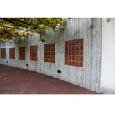 Braille-inspired wall installation by Paolo Grassi at Casa Tarcisio in Tenero, using colored raised dots in a numerical sequence.