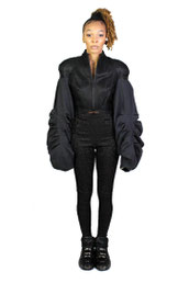 model wearing leggings and a puffy sleeve zip jacket