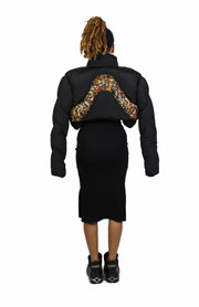 model with dress and cropped puffer jacket