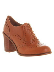 Tan heeled brogue shoes
