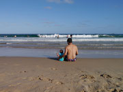 father and son on the beach in Wollongong, New South Wales, Australia