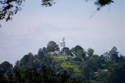 view of a big Buddha from Lake Kandy