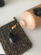 Applying an antique gold paste.