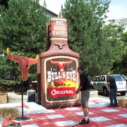 "BULL´S-EYE" Giant BBQ Sauce Bottle and GIant Tablecloth. Designer, Sculptor, Scenic Artist. 2000