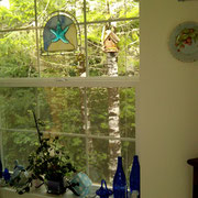 The same bird house as seen from inside the kitchen