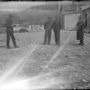 1925. A group of workers in Rovereto (TN); one of them takes in his hands a vintage camera.