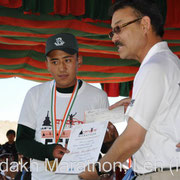 Award Ceremony: Rigzin Norboo, winner Khardung-La Challenge, time: 06:55:02, is awarded by Honorable Rigzin Spalbar, Chief Executive Councillor of Leh