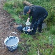 Stephen is getting our water for the lime wash straight from the hillside.  