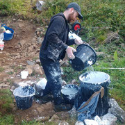 Stephen mixing lime wash. 