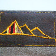 Handstitched Dutch Mountain logo on leather etiquette