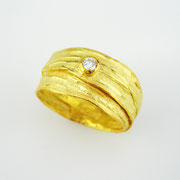 Breiter Bastring in 750er Gelbgold mit Brillant TW VSI in Feingold gefasst