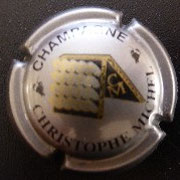 Marque : CHRISTOPHE N° Lambert : 22 Couleur : Argent et or Description : Pupitre d eremuage  et intitiales CM  Emplacement : 