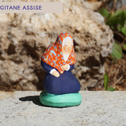 Gitane assise