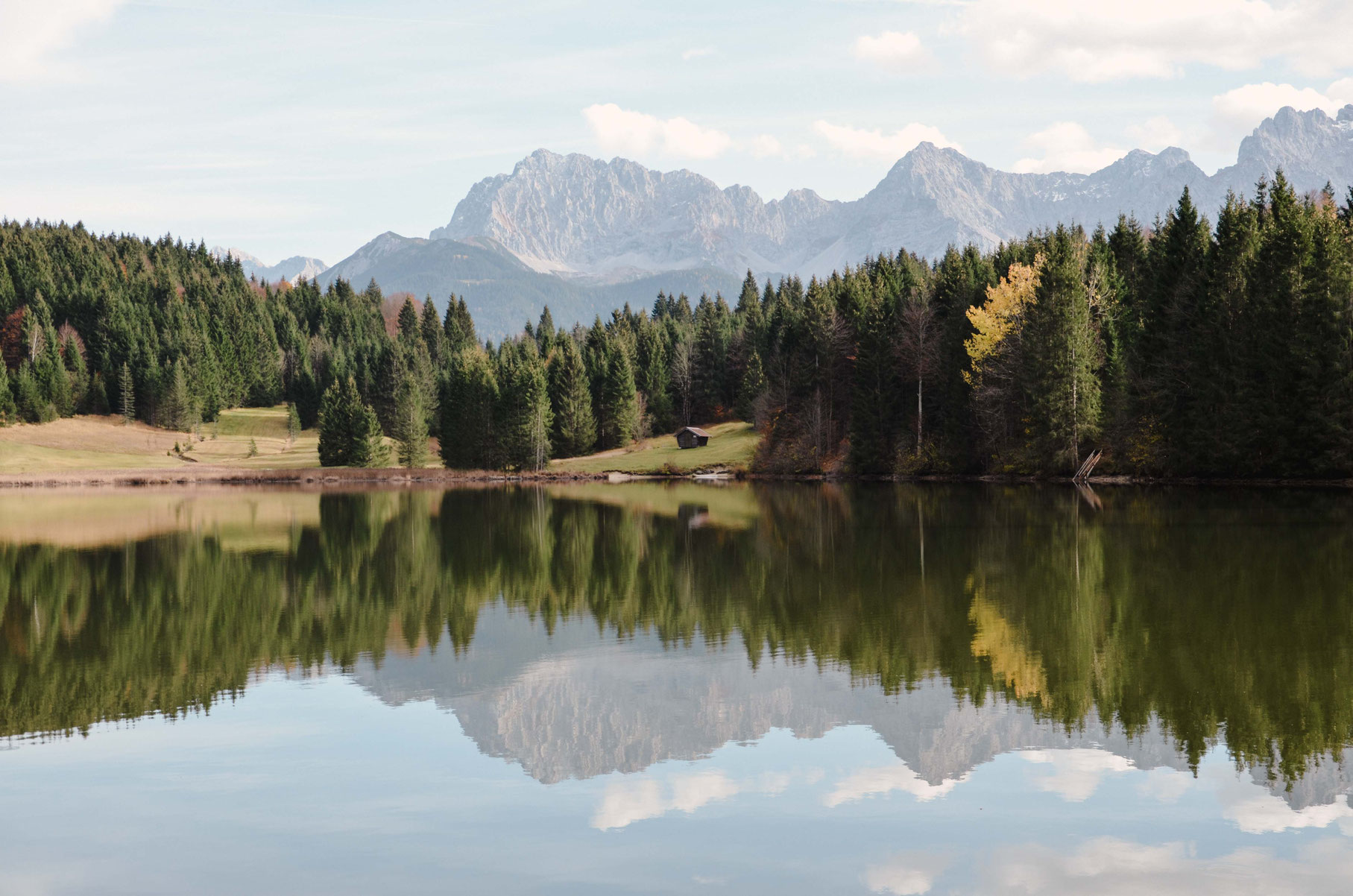 Mountains reflected in the calm waters of Geroldsee in Bavaria