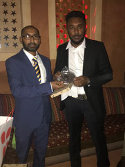 Sahan Lakshitha (r) receives the best bowler award