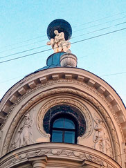 Sculpture of three Atlases holding up the world in Old Riga