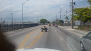 Picture of a young man riding a quad on two wheels