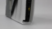 Cross-section of a laptop bag showing thick bottom cushioning that protects a laptop from impact.