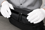 Final quality inspection of a Japanese-made laptop bag before shipment