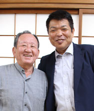 自治会長の浦 審良さん（左）と山﨑猛さん