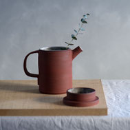 Handmade teapot of red clay