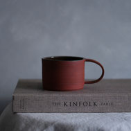 Handmade mug of red clay
