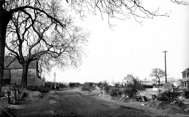 Hanging Lane 1935 with Tessall Farm barn (left) -  North Worcestershire Golf Club clubhouse on the horizon (right) - viewed from the junction with Tessall Lane.