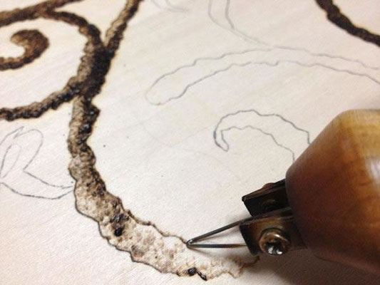 I burned the portion of the illustration by the machine which burns a wooden board.