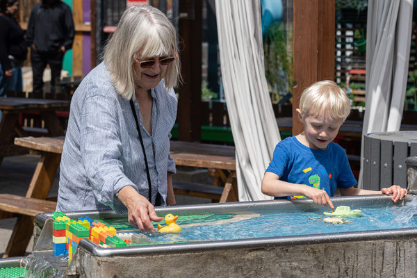 Owen with Grandma - water table -San Diego Children's Discovery Museum