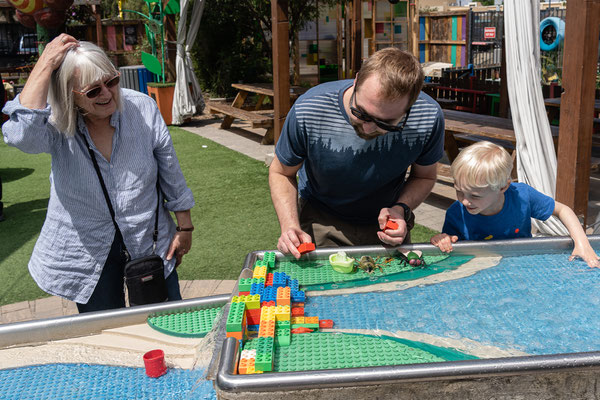 Owen with Grandma and Dad - water table -San Diego Children's Discovery Museum