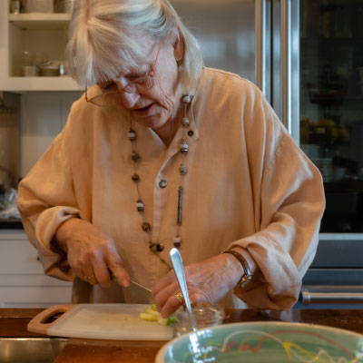 David's 90th birthday party - Kathy helping with the food