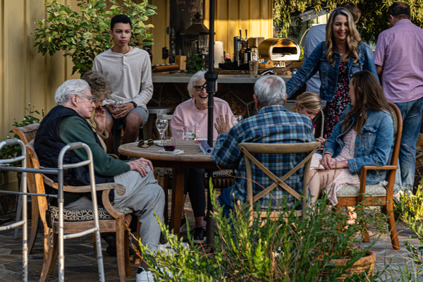 David's 90th birthday party guests - chatting over a drink