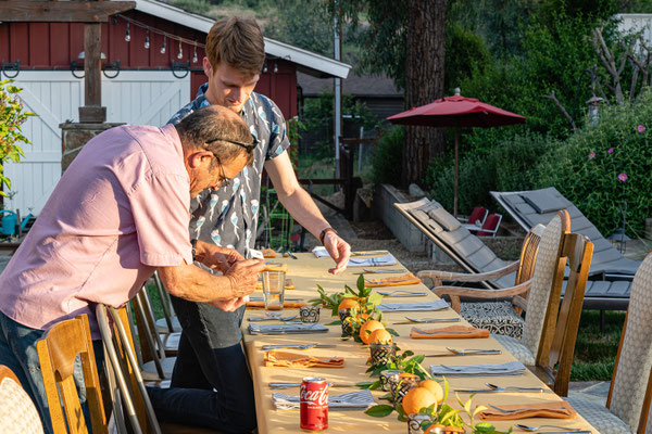 David's 90th birthday party - Tim and Matthew setting the table